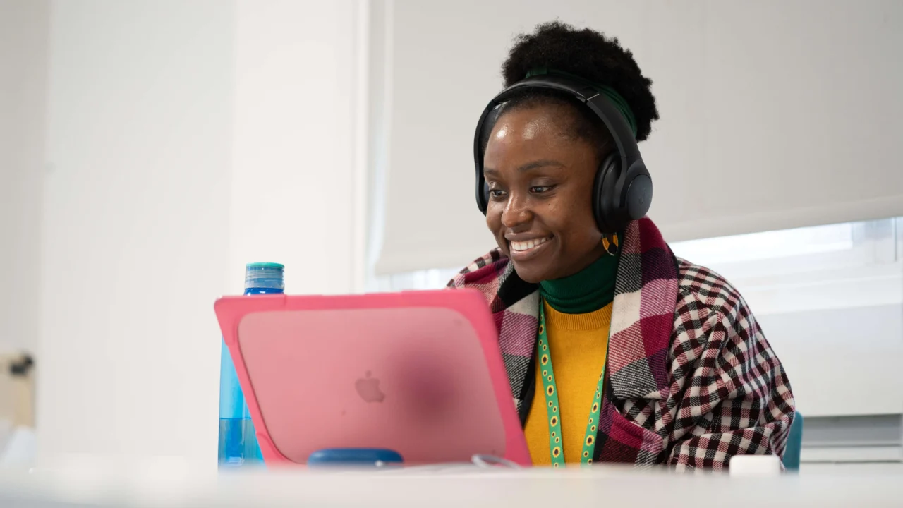 Business student in class with laptop