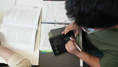 Business student in class working