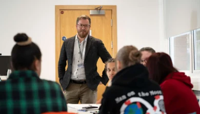 Education, Childhood and Professional Studies academic in class with students