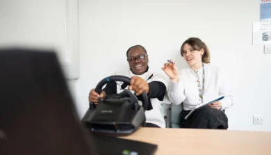Psychology student and lecturer using driver simulator
