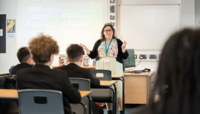 Secondary Education teacher in classroom with students