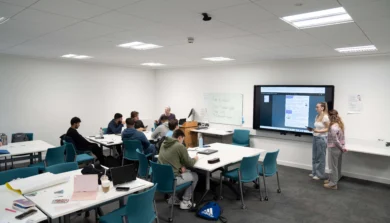 Secondary students at front of class